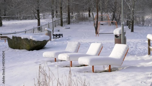 Wallpaper Mural Public Park Vacant Sun Lounger Chairs In Cold And Snowy Winter Scenery Torontodigital.ca