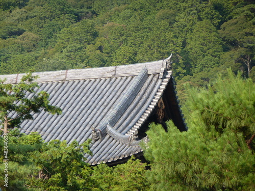 Temple roof surrounded by at the beginning of Philosopher's Path on a sunny summer day (horizontal), Kyoto, Japan