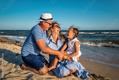 happy family on windy beach