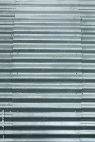 A close-up of metal plates atttached to each other with rivets 