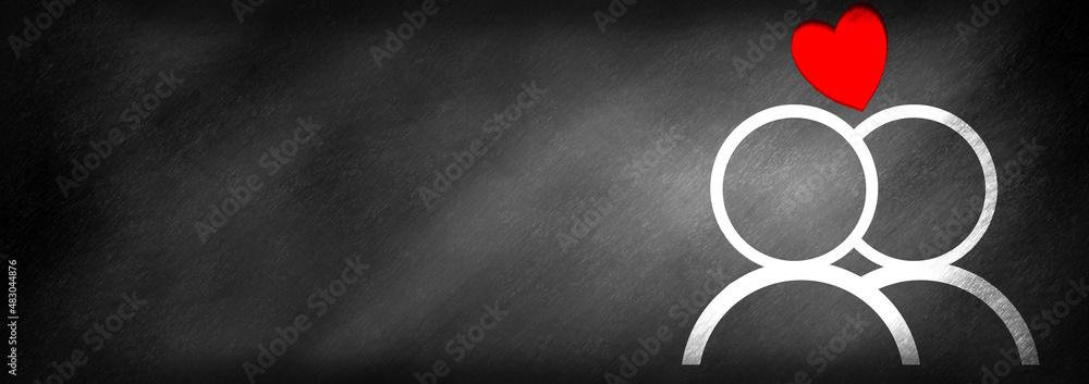 Φωτογραφία A heart above two people drawn on a blackboard background
