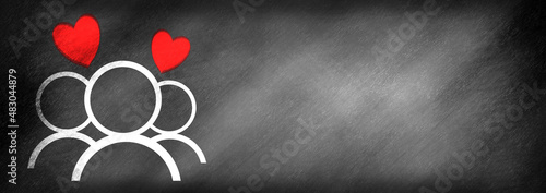 Tableau sur toile Two hearts above three people drawn on a blackboard background, symbolic for pol