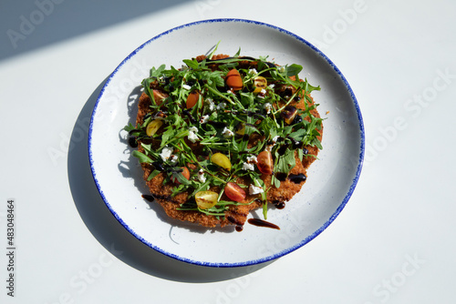 Fototapeta Chicken Milanese served in a round plate on