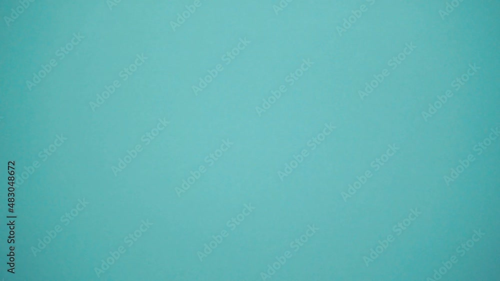 Close-up businessman's hand passes dollars on a blue background. Cash for exchange, investment and savings for the future. Receiving a salary, loan or debt. Buying and selling for cash. Close-up businessman's hand passes dollars on a blue background. Cash for exchange, investment and savings for the future. Receiving a salary, loan or debt. Buying and selling for cash.