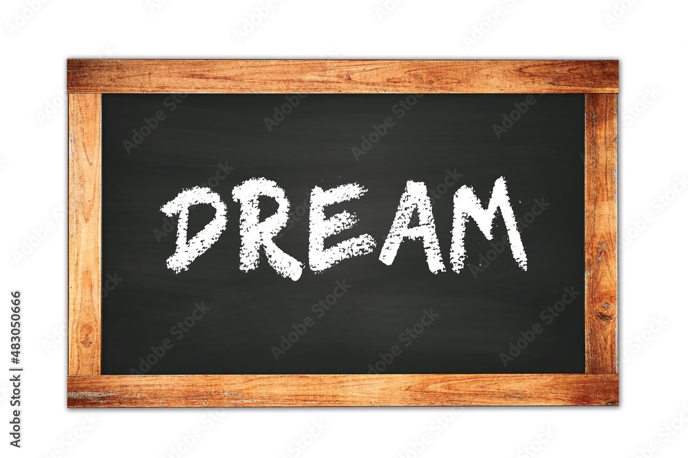 DREAM text written on wooden frame school blackboard. DREAM text written on wooden frame school blackboard.