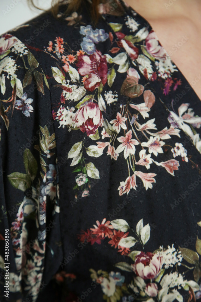 Close up of dark floral viscose fabric