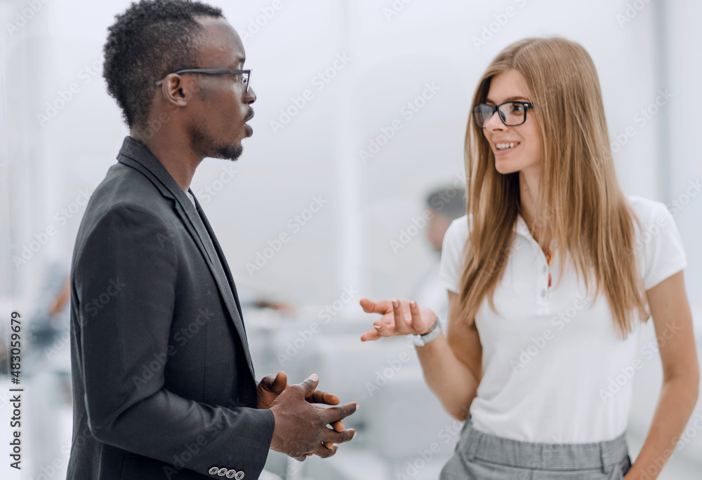 afro american guy and girl talking in the office afro american guy and girl talking in the office