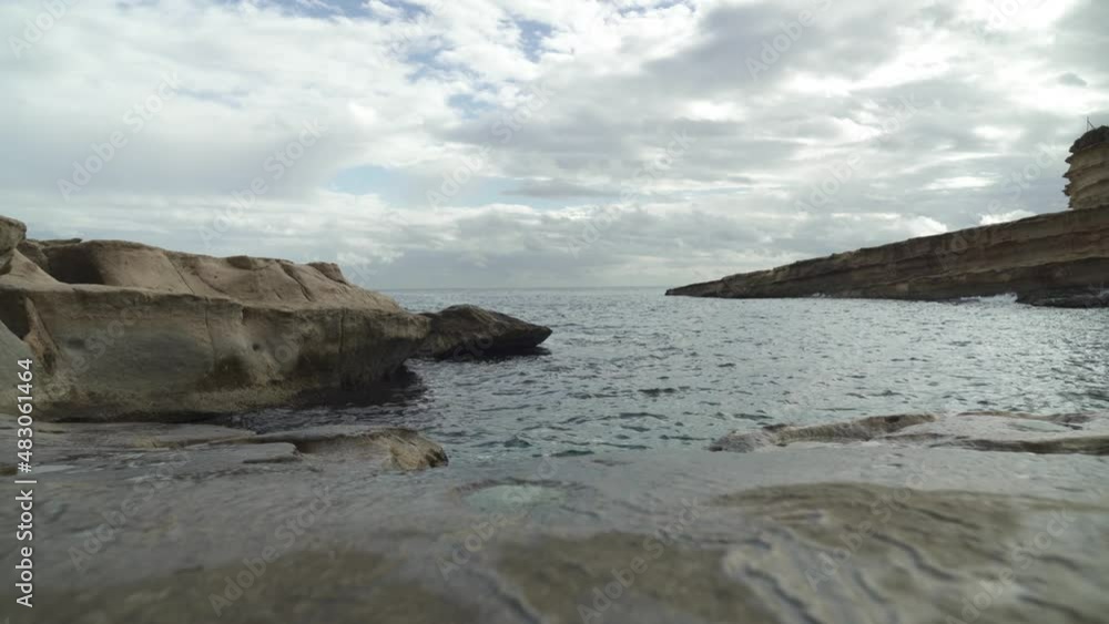 Low Angle Shot of St Peter’s Pool Stone Beach Shoreline with Mediterranean Sea in Background Low Angle Shot of St Peter’s Pool Stone Beach Shoreline with Mediterranean Sea in Background