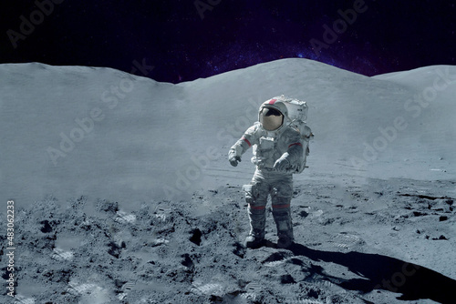 Fototapeta Naklejka Na Ścianę i Meble -  Astronaut on the moon, with galactic background. Elements of this image were furnished by NASA.