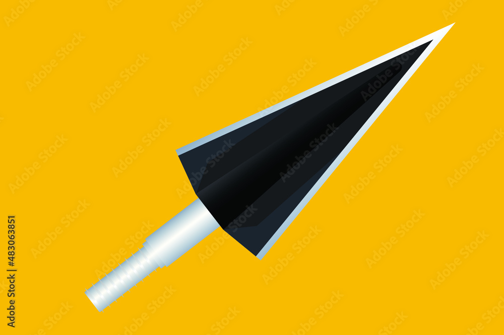 steel arrowhead covered with black paint on a yellow background steel arrowhead covered with black paint on a yellow background