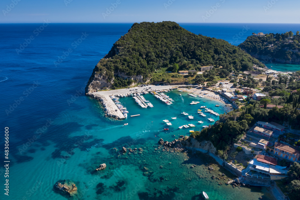 Aerial view of Corfu  marina  in the turquoise sea.  Top view from drone