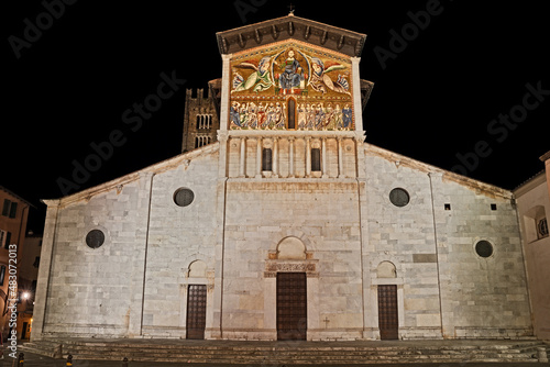 Lucca, Tuscany, Italy: the medieval Roman Catholic abbey dedicated to Saint Fridianus (Italian: San Frediano) with a huge golden 13th century mosaic  on the facade photo