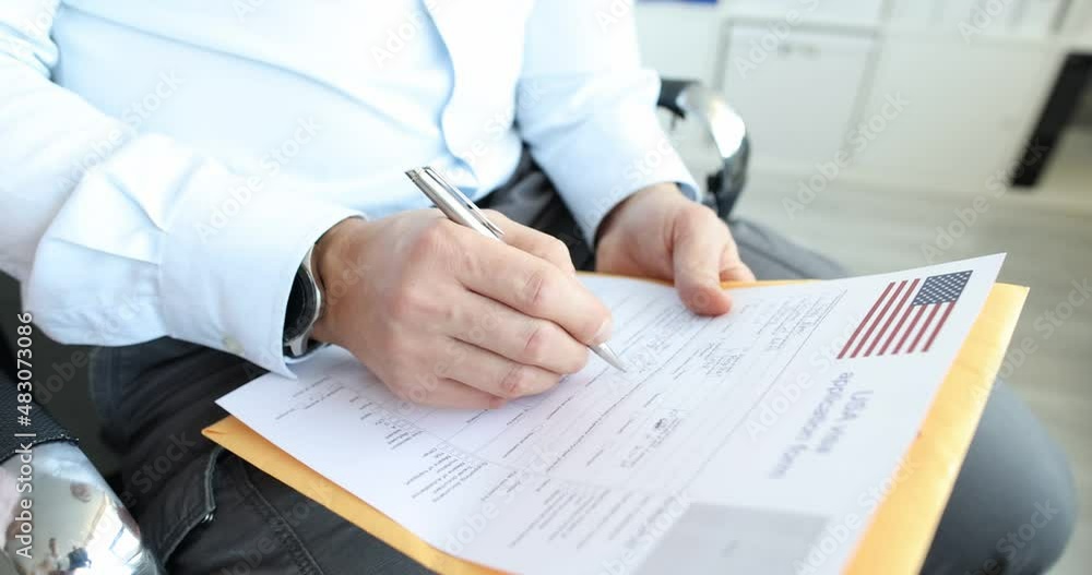 Group of people fill out US visa application form closeup Group of people fill out US visa application form closeup