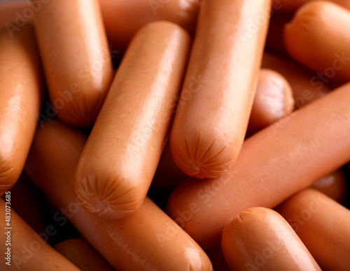 raw boiled meat pork sausages, close up, background