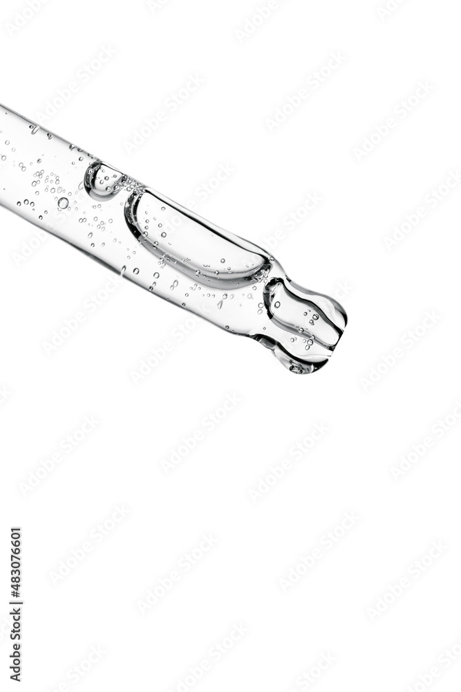 Transparent pipette with cosmetics on a white isolated background. Transparent pipette with cosmetics on a white isolated background.