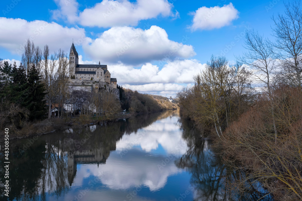 View towards the Basilica of Dietkirchen/Germany, which is reflected in the Lahn 