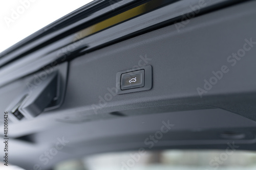 trunk control button in the car interior