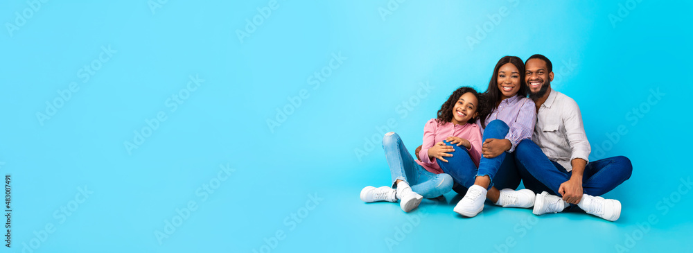 Black Husband Hugging Smiling Lady And Girl Sitting On Floor Stock Black Husband Hugging Smiling Lady And Girl Sitting On Floor Stock