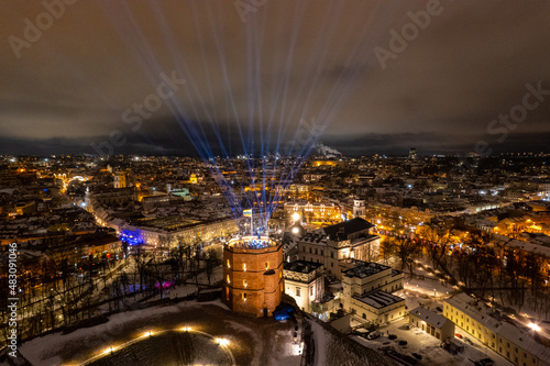 Aerial winter night view of snowy Vilnius old town, Lithuania