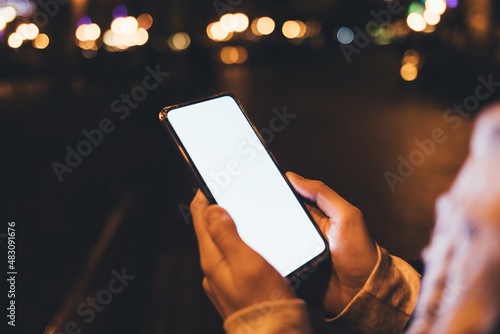 Close-up smartphone with blank display in female hands