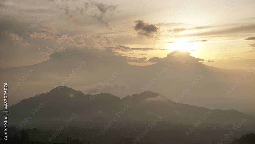 sunrise over the mountains in cloudy weather. This is taken from Famous spot to see sunrise named Mangli Sky View. The place is named 