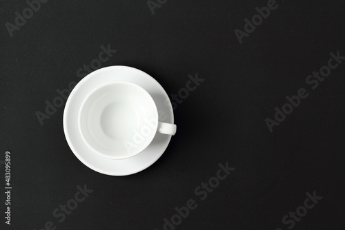 white cup on black