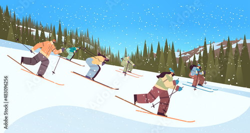 people skiing men women tourists doing activities winter vacation concept snowfall landscape background