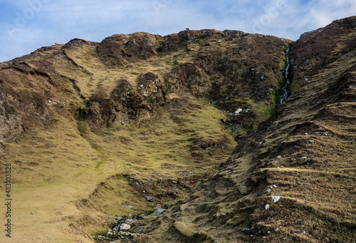 Waterfalls of the green Minaun cliffs on the coast of Trawmore Sand on Achill Island photo