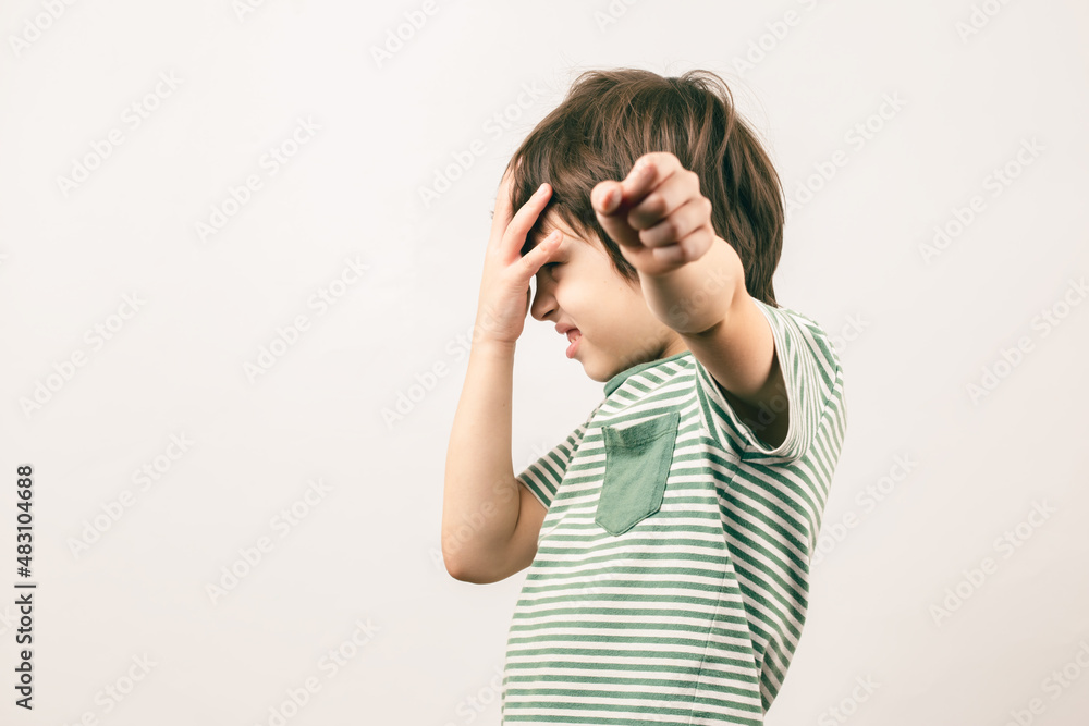 Kid quarreling and fighting showing fist to enemy Kid quarreling and fighting showing fist to enemy
