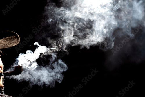 Smoke cloud of pipe smoking vintage lifestyle