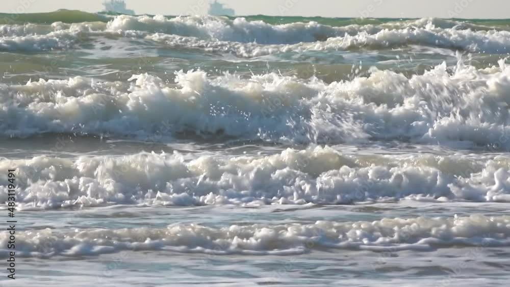 Large waves with foam near the shore during a strong storm, Black Sea, Ukraine Large waves with foam near the shore during a strong storm, Black Sea, Ukraine