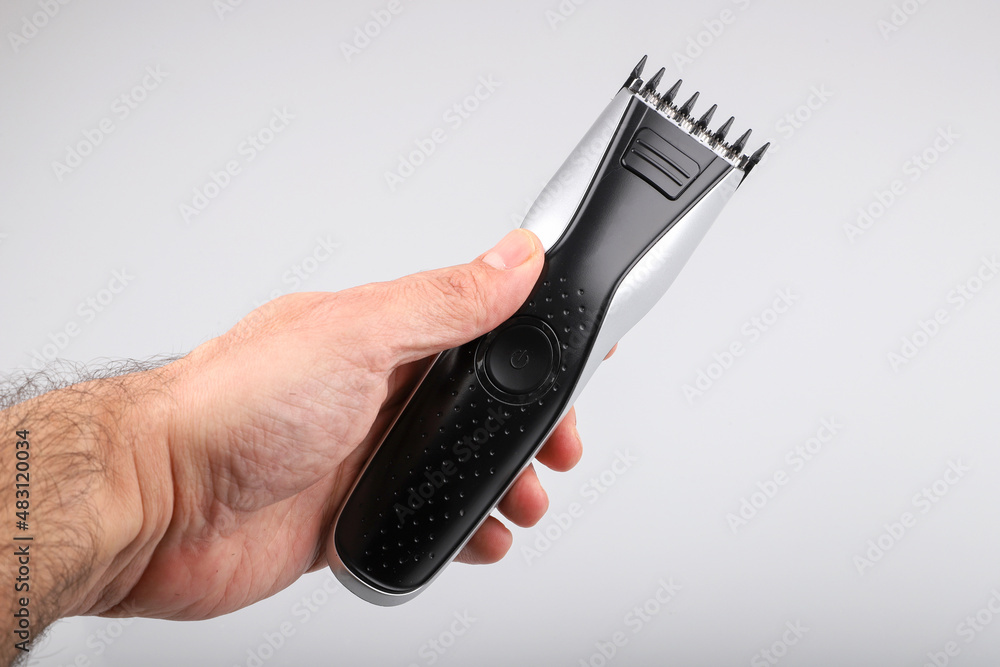 Modern battery electric shaver for man isolated on white background. Top view. Modern battery electric shaver for man isolated on white background. Top view.