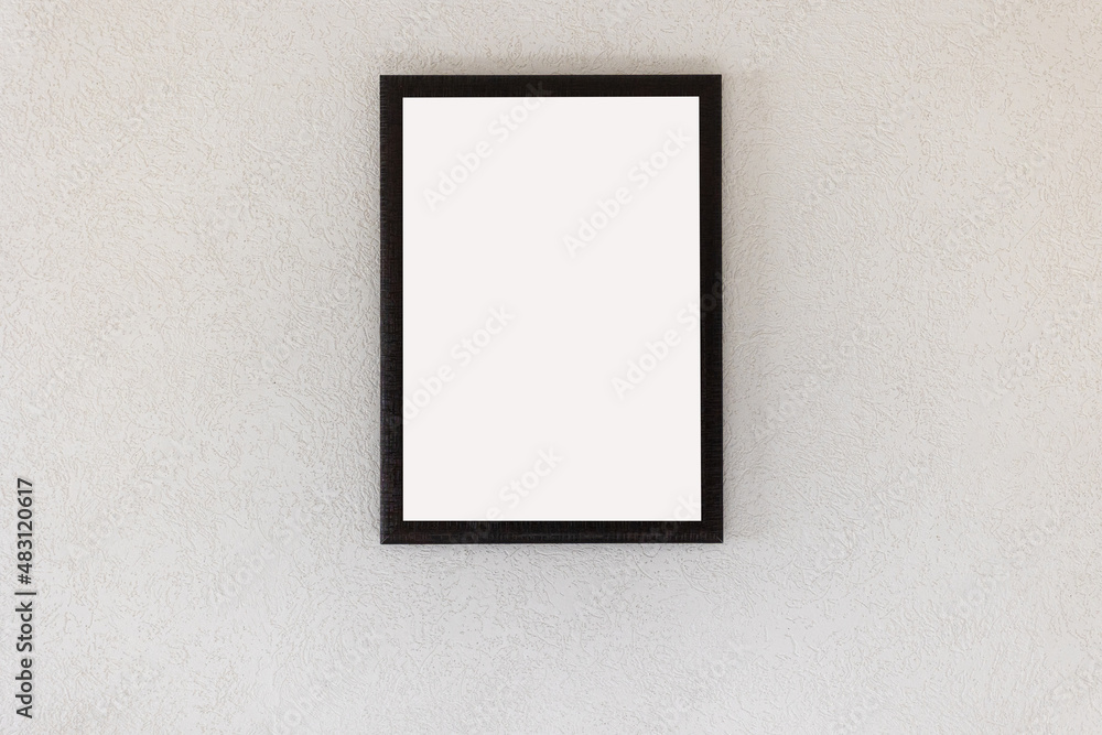 empty picture frame hanging on a white wall in the room empty picture frame hanging on a white wall in the room