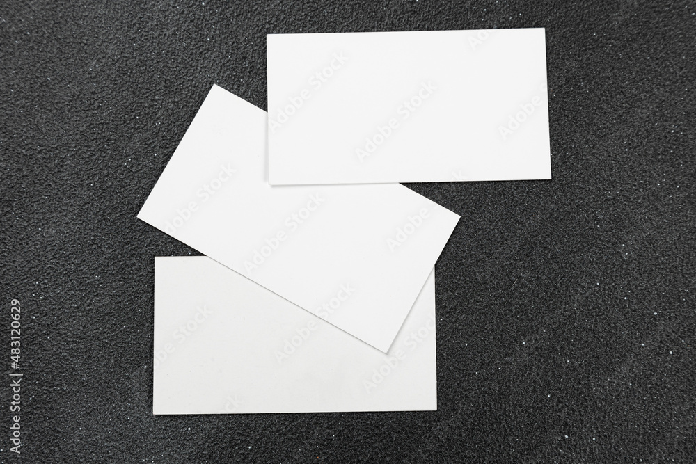 Photos of business cards. Mock-up for corporate identity on a black background. For graphic designers presentations and portfolios Photos of business cards. Mock-up for corporate identity on a black background. For graphic designers presentations and portfolios