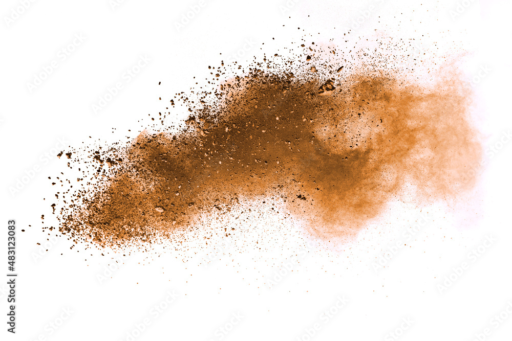 Abstract brown powder explosion. Closeup of brown dust particle splash isolated on white  background