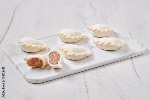 Frozen dumplings stuffed with beef meat and provencal herbs