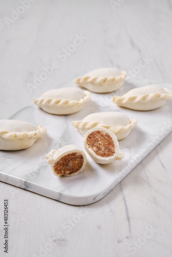 Frozen dumplings stuffed with beef meat and provencal herbs