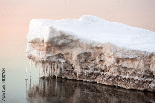 ice cube with icicles in the sea