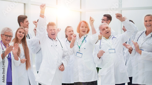group of medical colleagues applauding their overall success.