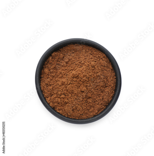 Bowl with nutmeg powder on white background, top view