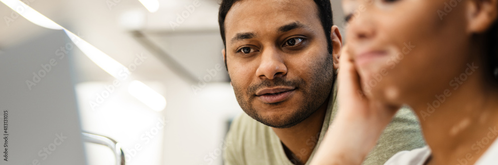 Obraz premium Mid aged multiethnic couple working together