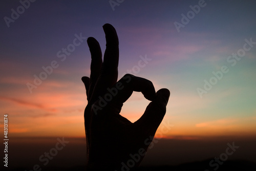 Pico do Gavião, Andradas, Minas Gerais, Brazil: hand making ok sign at sunset