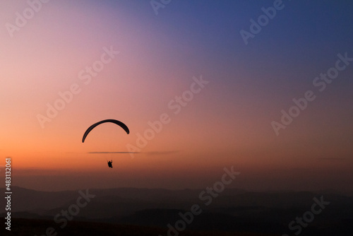 Pico do Gavião, Andradas, Minas Gerais, Brazil: sunset at the top of mantiqueira mountain with paraglaider flight