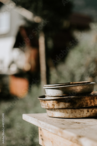 Ingredients for dough making, in old copper bowls and on the old wooden table, rustic style