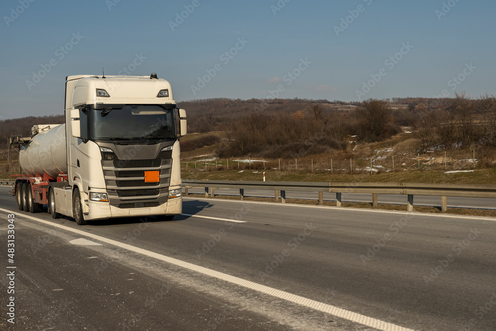 Fuel truck on the road. Truck transporting fuel on the highway. Fuel truck on the road. Truck transporting fuel on the highway.