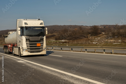 Fuel truck on the road. Truck transporting fuel on the highway. © Bojan