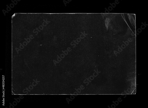 Old Black Empty Aged Damaged Paper Cardboard Photo Card Isolated on Black. Real Halftone Scan. Folded Edges. Rough Grunge Shabby Scratched Torn Ripped Texture. Distressed Overlay Surface for Collage.  photo