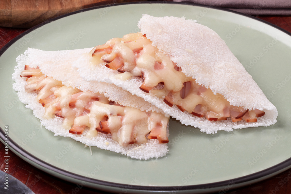 Focus on Brazilian tapioca stuffed with turkey breast and cheese. . Focus on Brazilian tapioca stuffed with turkey breast and cheese. .