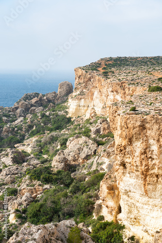 The rocks at the rough coast of the Mediterranean sea near Manikata, Malta