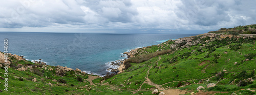 View over the rocks, valleys and local agriculture at the bay of the Mediterranean sea, Selmun, Malta